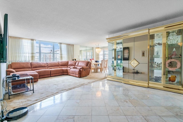 carpeted living room with a textured ceiling