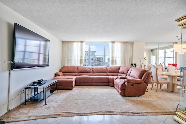 tiled living room featuring a textured ceiling