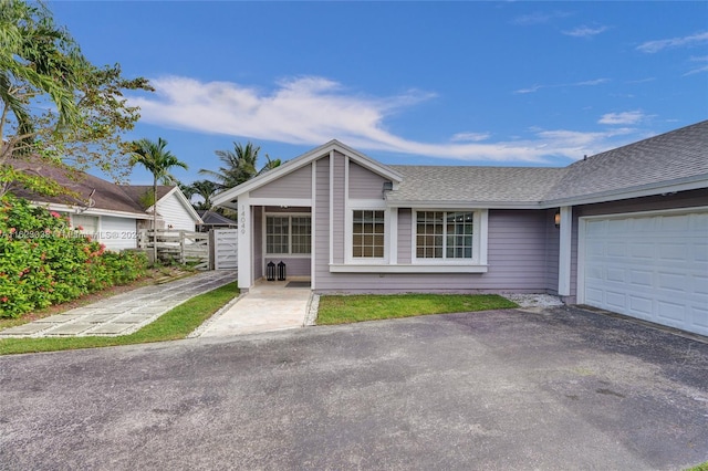 single story home featuring a garage