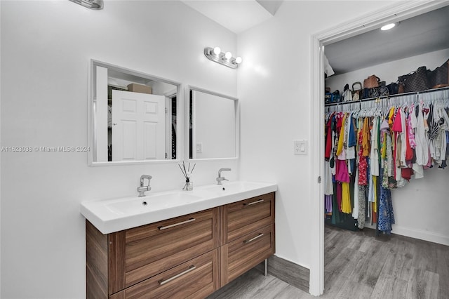 bathroom featuring vanity and hardwood / wood-style floors