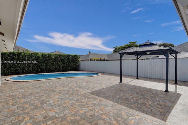 view of pool with a gazebo and a patio area