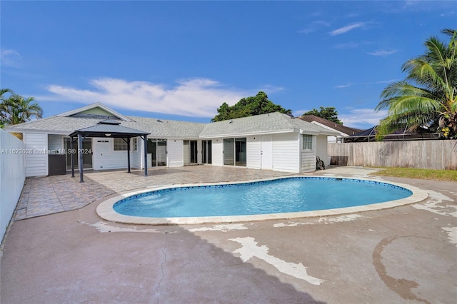 view of pool featuring a gazebo and a patio area