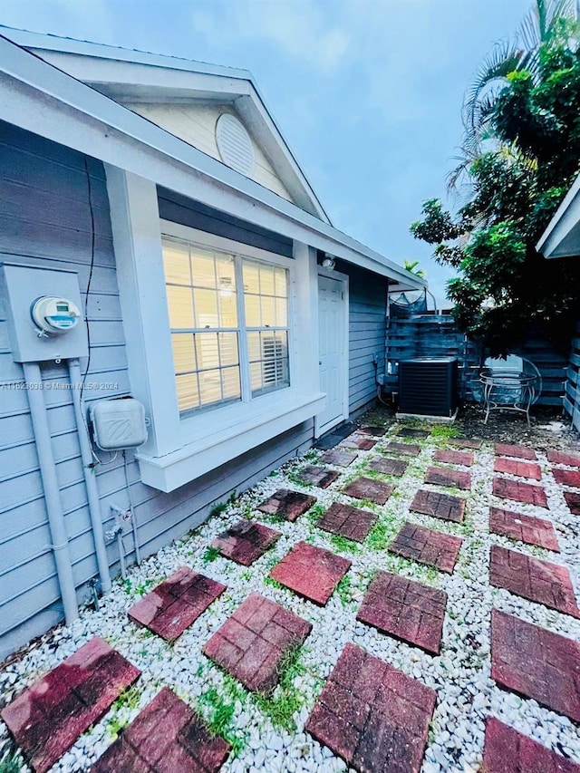 view of side of home featuring central AC and a patio area