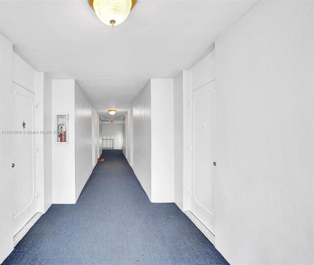 corridor with dark carpet