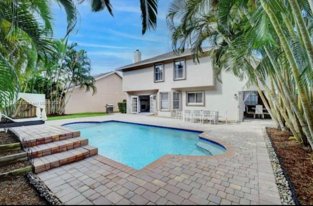 view of pool featuring a patio area