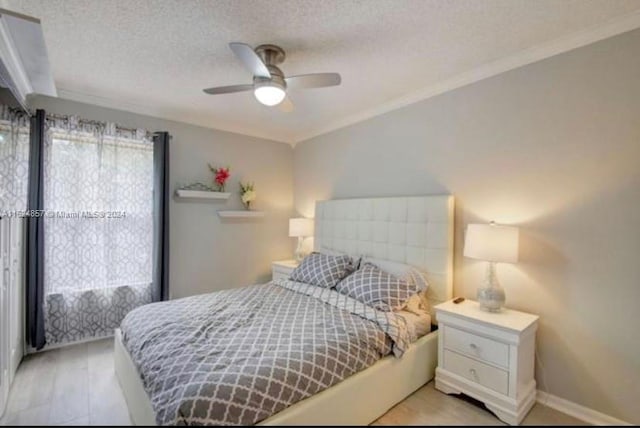 bedroom with crown molding, a textured ceiling, and ceiling fan