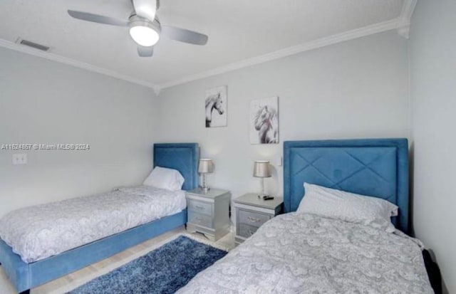 bedroom featuring crown molding and ceiling fan