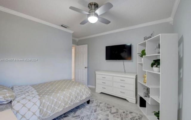 carpeted bedroom featuring ceiling fan and ornamental molding