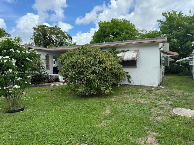 exterior space with a yard