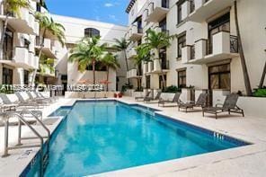 view of swimming pool with a patio