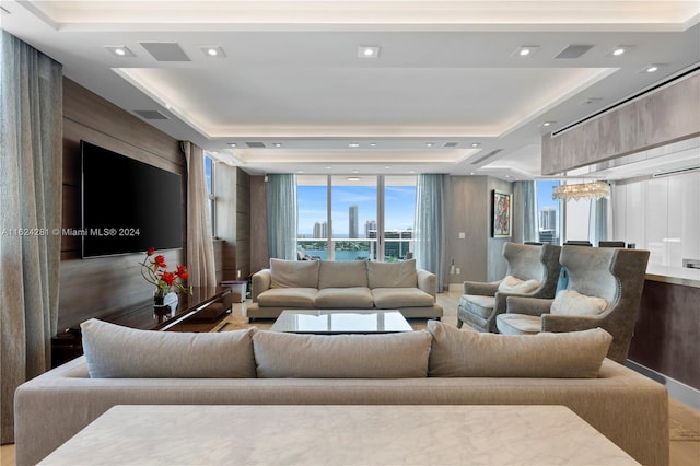 living room featuring a raised ceiling