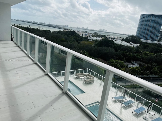 balcony featuring a water view