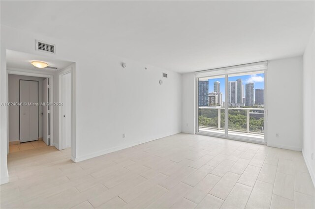 4250 Biscayne Blvd Unit 1018, Miami, FL 33137 - unfurnished room with a wall of windows and a skyline view
