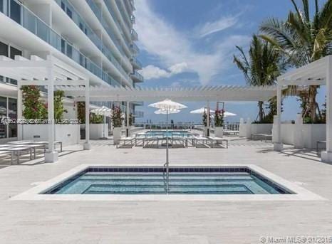 4250 Biscayne Blvd Unit 1018, Miami, FL 33137 - community pool with a pergola and a patio area