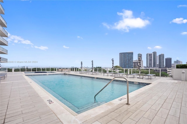 4250 Biscayne Blvd Unit 1018, Miami, FL 33137 - community pool featuring a patio area and a view of skyline