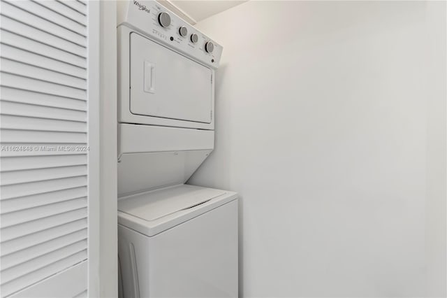 laundry area with stacked washer and dryer