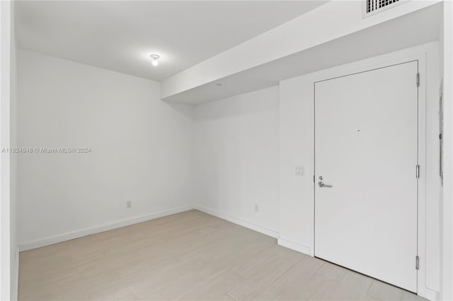 spare room featuring light wood-type flooring