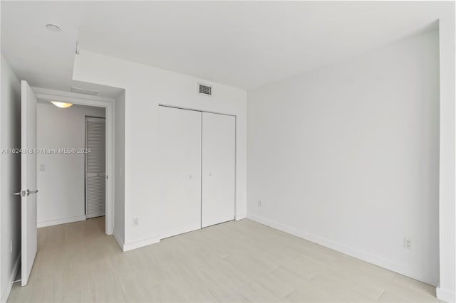 unfurnished bedroom featuring a closet