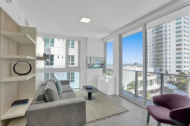 living room with light tile patterned floors and expansive windows