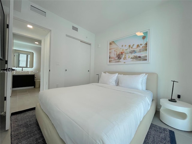 bedroom featuring tile patterned floors