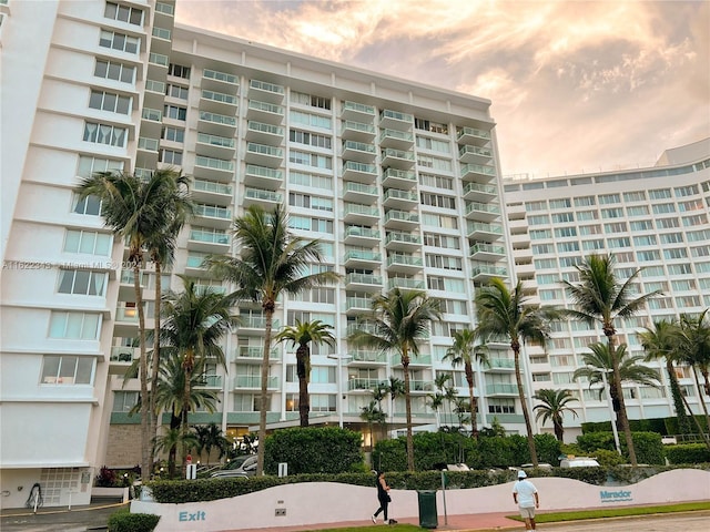 view of outdoor building at dusk