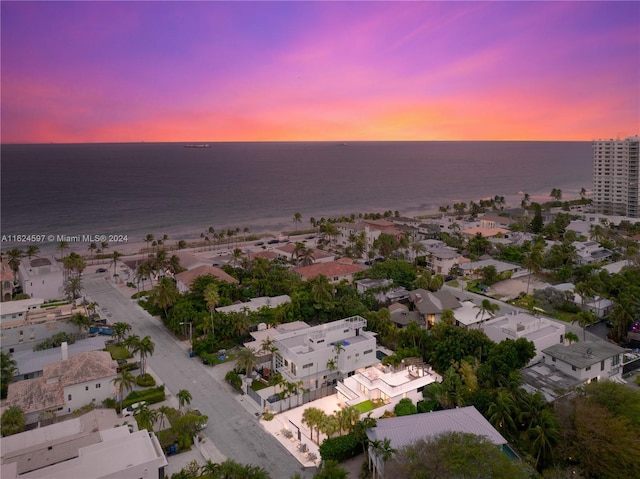 aerial view at dusk with a water view