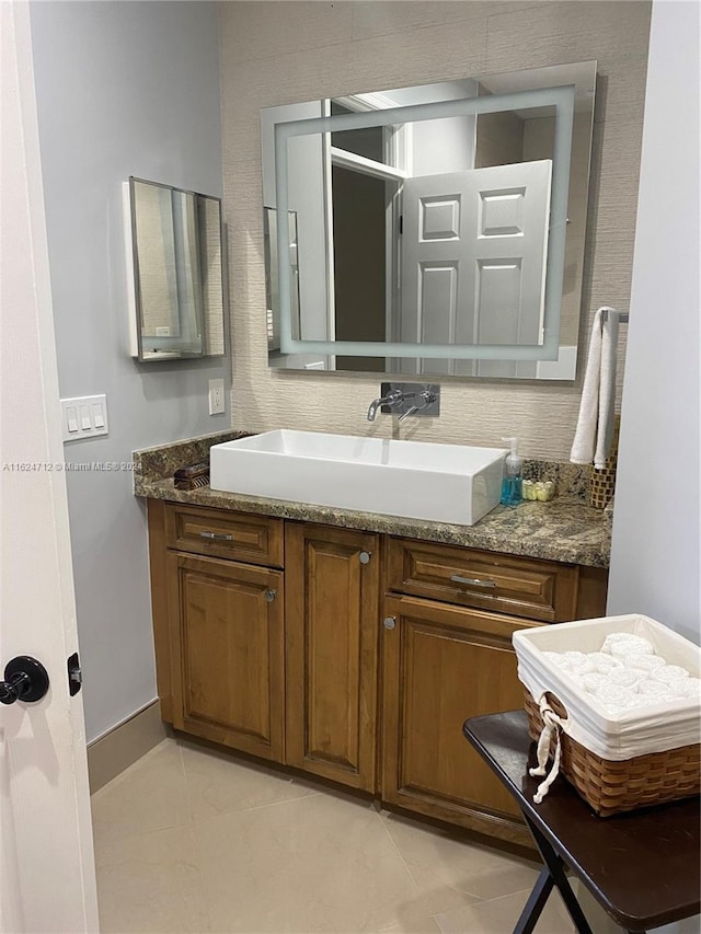 bathroom with vanity, tasteful backsplash, and tile patterned floors