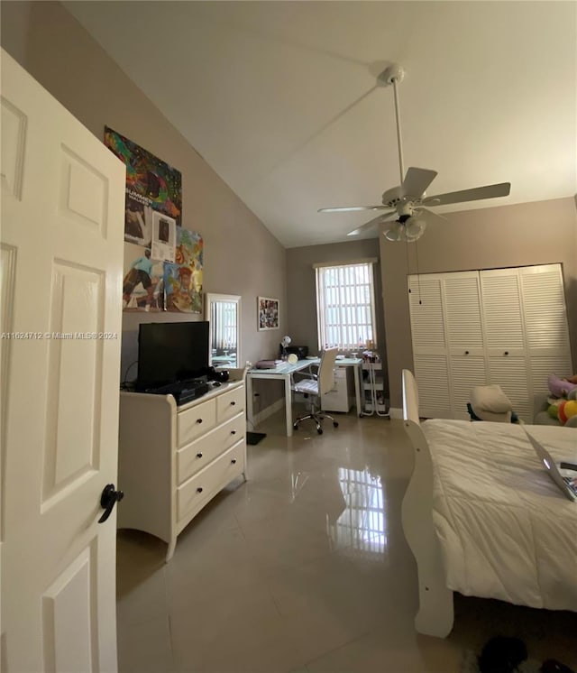 bedroom featuring ceiling fan, a closet, and vaulted ceiling