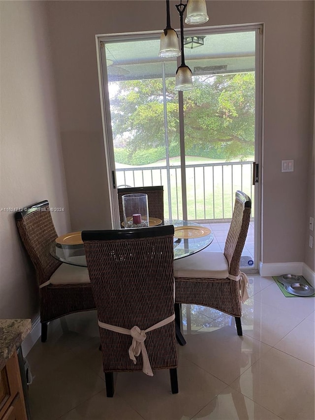 dining room with plenty of natural light, a notable chandelier, and tile patterned flooring