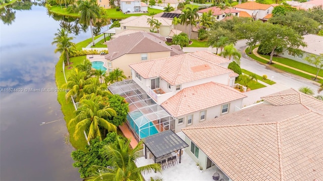 drone / aerial view with a residential view and a water view