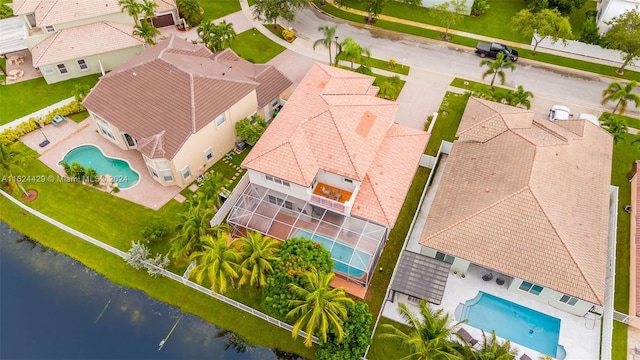 birds eye view of property with a water view