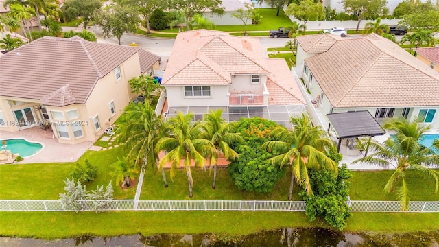 bird's eye view with a residential view and a water view