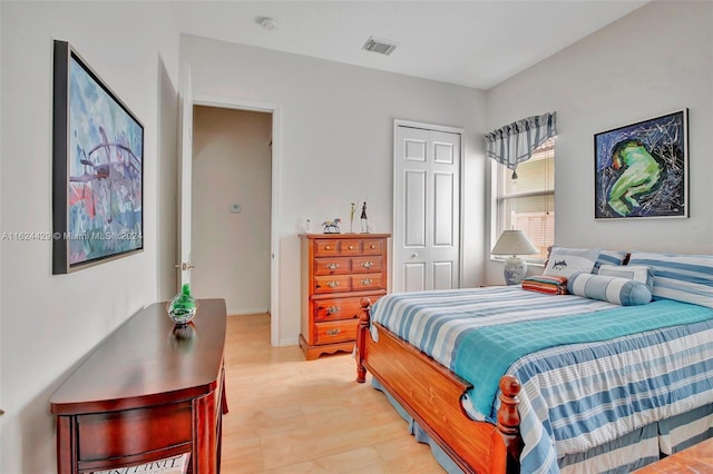 bedroom featuring a closet and visible vents