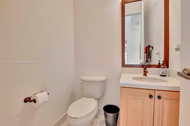 bathroom with toilet and vanity