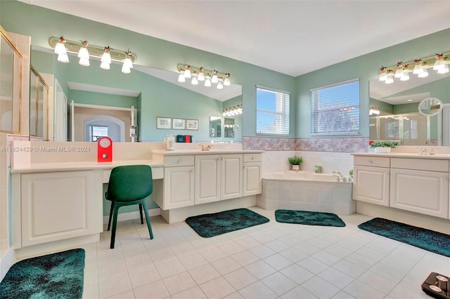 full bathroom featuring tile patterned flooring, a shower stall, a garden tub, two vanities, and a sink