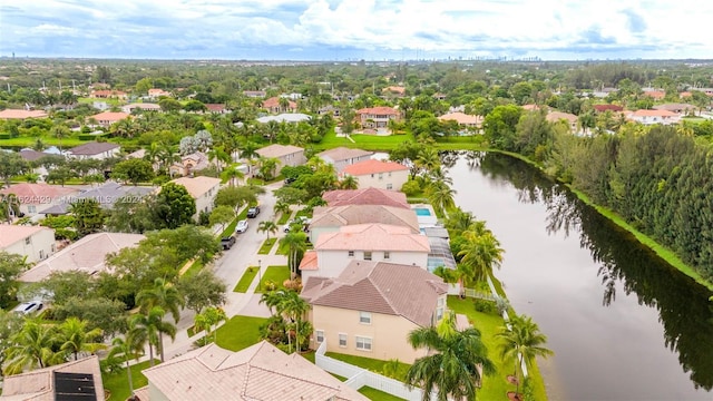 bird's eye view with a water view and a residential view