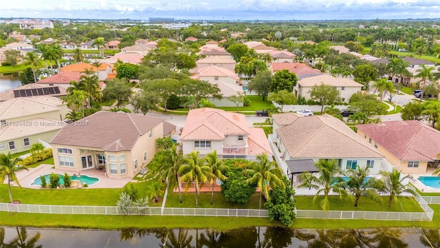 bird's eye view with a residential view and a water view