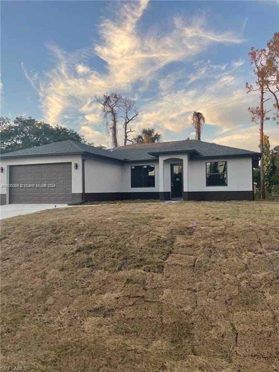 single story home featuring a garage