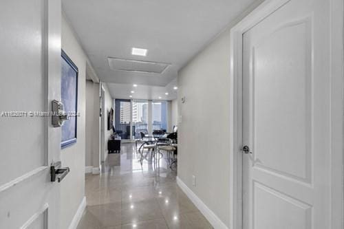 hallway with light tile patterned floors