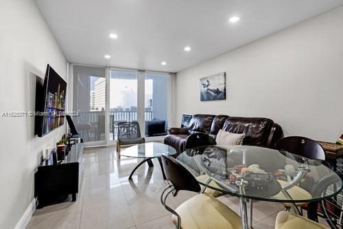 living room featuring expansive windows