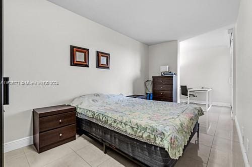 bedroom featuring light tile patterned floors