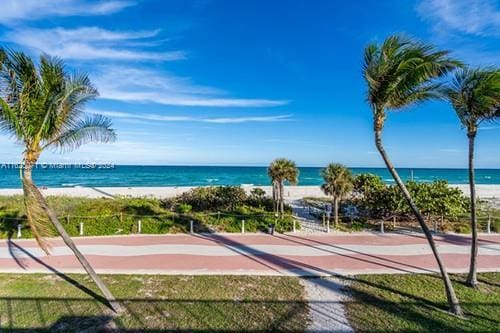 property view of water featuring a beach view