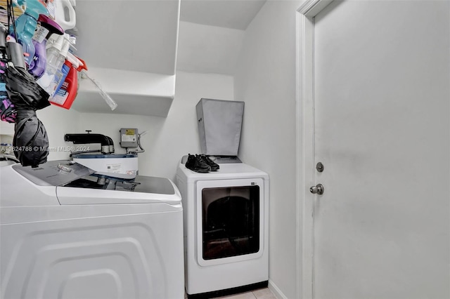 kitchen with white cabinetry, light tile patterned floors, stainless steel appliances, a kitchen breakfast bar, and sink