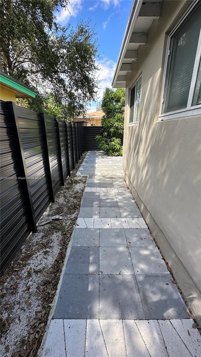 135 NW 68th St, Miami, FL 33150 - fenced backyard featuring a patio area