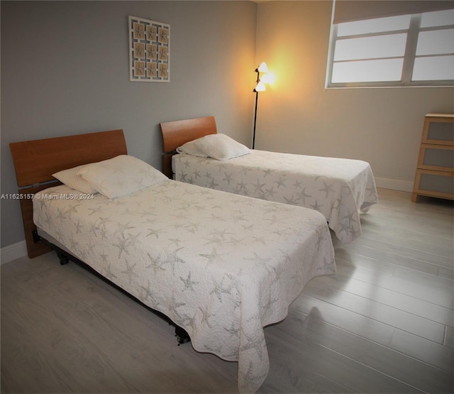 bedroom featuring wood-type flooring