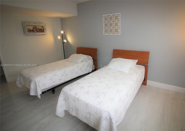 bedroom featuring wood-type flooring