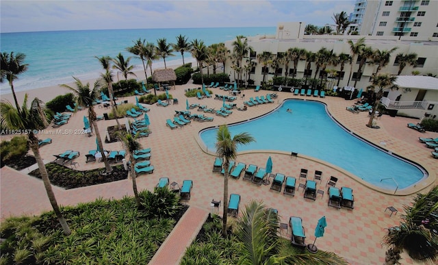 view of swimming pool with a water view