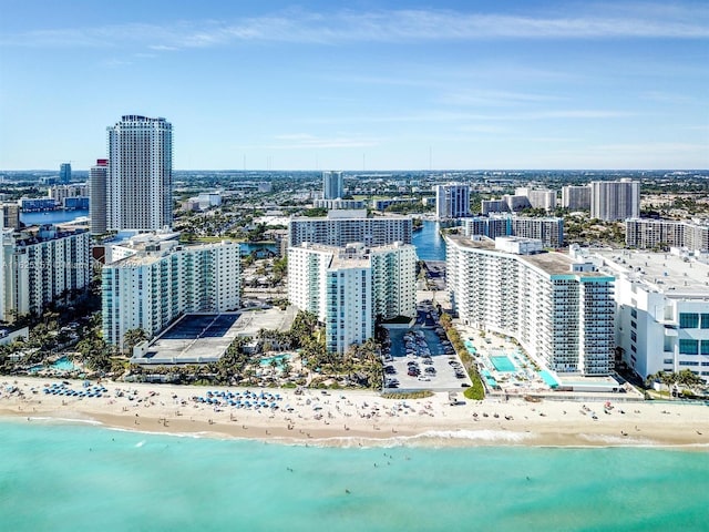 property's view of city featuring a view of the beach and a water view