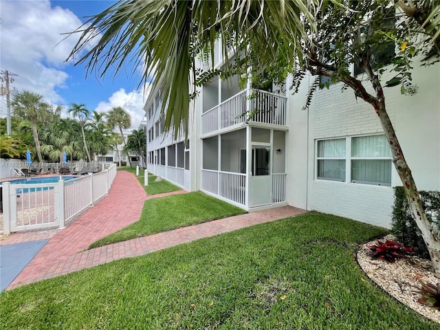 exterior space featuring a fenced in pool