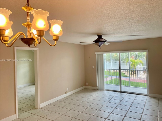 empty room with ceiling fan with notable chandelier, light tile patterned flooring, and a textured ceiling